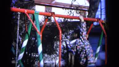 Camden New Jersey US (1964): A Kid Plays On The Playground But She Doesn't Look