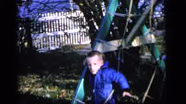Camden New Jersey US (1964): Young Boy Is Tangled In Playground Equipment Giggling