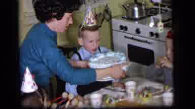 Camden New Jersey US (1964): Small Child Wearing Party Hat Blowing Out Candles On