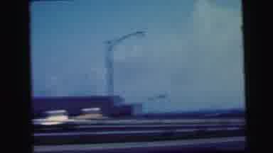 Camden New Jersey USA (1964): Man Wearing White Shirt Adjusts Camera On Tripod On