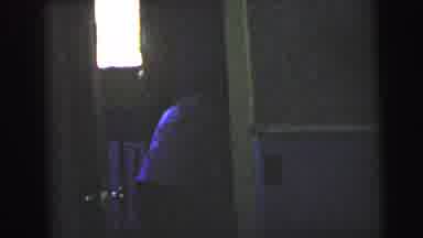Camden New Jersey USA-1964: Person Hiding In Hotel Bathroom With Purple Lighting