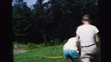 Camden New Jersey USA (1964): One Person And One Lady Playing Something And