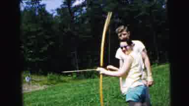Camden New Jersey USA (1964): A Man Teaching A Woman How To Draw And Shoot A Bow