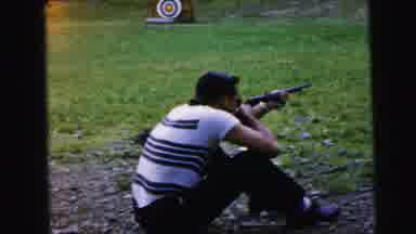 Camden New Jersey USA (1964): Man Sitting Down Preparing To Shoot Against A Sport