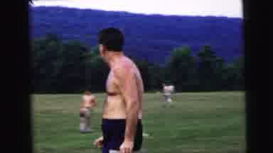 Camden New Jersey USA (1964): Man Walks By Camera While Looking Over His Shoulder
