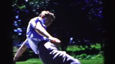 Camden New Jersey USA (1964): Woman Takes Off Shoes To Follow Man Down A Slide