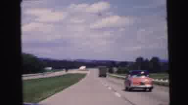 Camden New Jersey USA (1964): Automobiles Travel Down A Highway In A Rural Area On