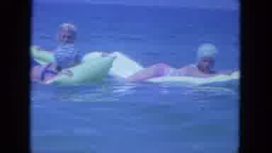 Clearwater Florida (1964): Three Woman Playing On Floaties In The Calm Clear Blue
