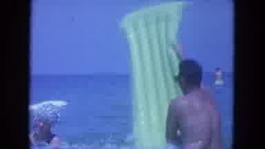 Clearwater Florida (1964): Man Plays With Women In The Beach Takes Her Floater