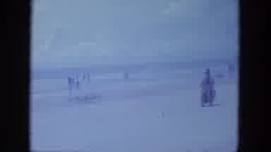 Clearwater Florida (1964): Two People At The Beach Riding A Motorcycle In The Sand
