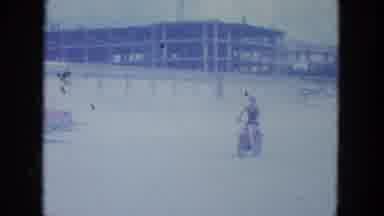 Clearwater Florida (1964): Woman Rides A Motorbike Down To The Beach While Others