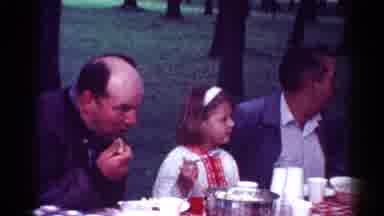 Cleveland Ohio (1964): Little Girl Sitting With 2 Men Eating At A Picnic Table In