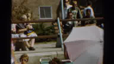 Cleveland Ohio (1964): People Sitting On White Benches At Beach On A Bright Sunny