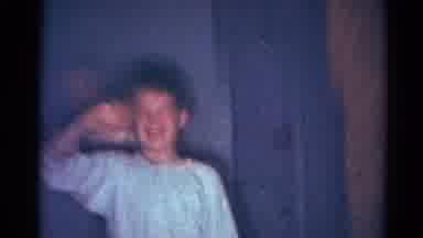 Cleveland Ohio (1964): Boy Wearing Pajamas And Waving At The Camera With His Eyes
