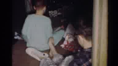 Cleveland Ohio (1964): Two Older Children Sitting On A Carpeted Floor Unwrapping