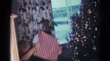 Cleveland Ohio (1964): People Unwrapping Christmas Presents On Christmas Day