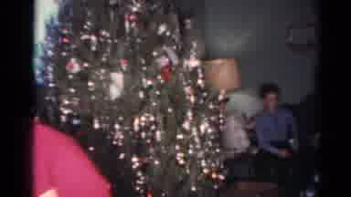 Cleveland Ohio (1964): Family Handing Out Christmas Gifts To Each Other To Unwrap