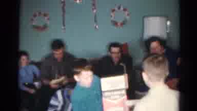 Cleveland Ohio (1964): Family Celebrating Christmas At Home Distributing Gifts To
