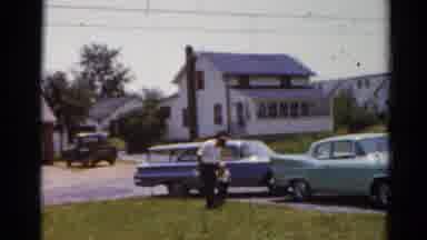 Elkhart Illinois USA (1964): Man With White Button-Up Shirt And Black Pants