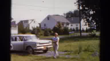 Elkhart Illinois USA (1964): Little Boy Follows Mother As She Carries Shopping In