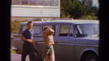 Elkhart Illinois USA (1964): Children Walk Together By The Car Then Look At The