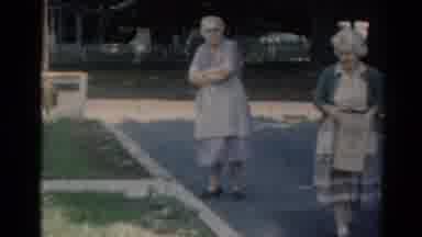 Elkhart Illinois USA (1964): Two Old Women Walking Down Street With Box