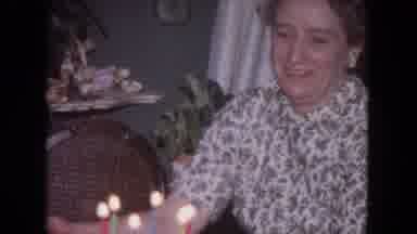 Evanston Illinois (1964): Woman In Room Looks Around At People And Birthday Cake