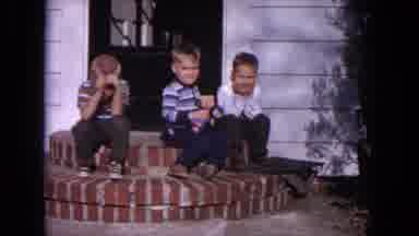 Evanston Illinois (1964): Two Children Are Enjoying To Play The Ground And