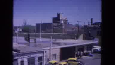 Evanston Illinois (1964): Man Leaving Train Passing Through City