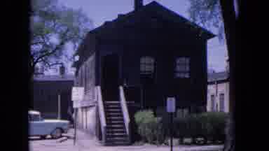 Evanston Illinois (1964): A Car Parked In Front Of A Cabin Near To Railway Station