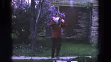 Evanston Illinois (1964): Woman In Headscarf Sees Camera And Moves Away While