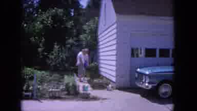 Evanston Illinois (1964): Adults Discuss The Gardening While Child Plays In