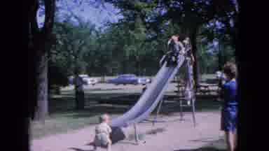Evanston Illinois (1964): Kids Playing In The Park On The Slide Taking Turn