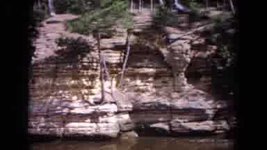 Evanston Illinois (1964): Panning Shot Of Rock Formations Along A River Or Highway
