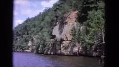 Evanston Illinois (1964): A View Of Ocean Surrounded By Bushes And Big Rocks