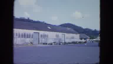 Grenada (1964): Woman Asking The Guard What Happened At The Factory