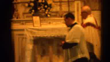 Harvard Illinois USA (1964): Two Clergymen Exit Stage Right During Catholic