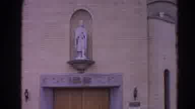 Harvard Illinois USA (1964): Video Of A Statue Over The Door Of A Church Or