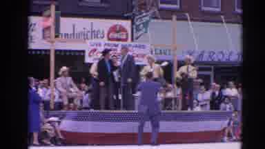 Harvard Illinois USA (1964): Men Wearing Yellow Shirts Play Guitars Onstage On A