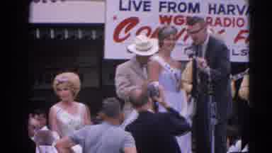 Harvard Illinois USA (1964): Man Speaking With Female Pageant Contestant;