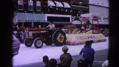 Harvard Illinois USA (1964): Tractor Pulling Parade Float Down Main Street