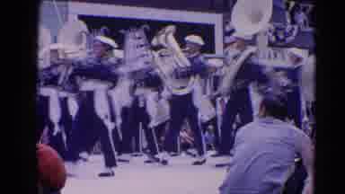 Harvard Illinois USA (1964): Band Members Wearing Blue And White Uniforms Marching