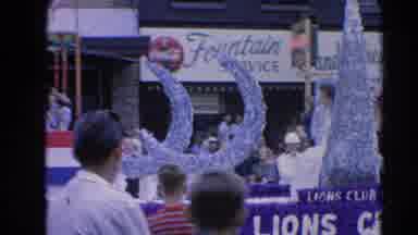 Harvard Illinois USA (1964): A Parade With A Person On A Float Waiving And A