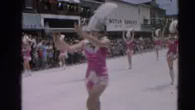 Harvard Illinois USA (1964): A Mother And Daughter Waving At People In Custom In A
