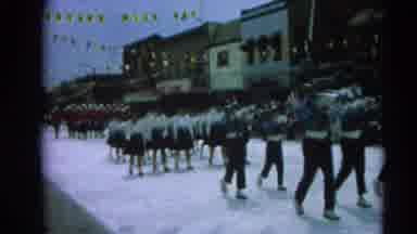 Harvard Illinois USA (1964): Group Of People Marching In The Street For A Festival