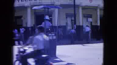 Kingston Jamaica (1964): The Traffic Guard Inspects The Vehicle Without Traffic