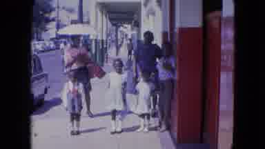 KINGSTON JAMAICA-1964: Children in Formal Wear Pose on Sidewalk Near Cruise Ship