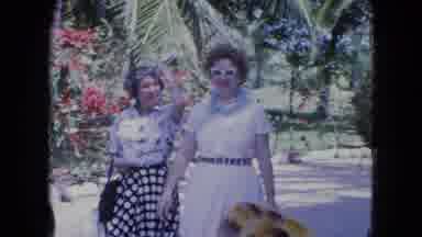 Kingston Jamaica (1964): Two Women Walking Through Town On A Busy Windy Day