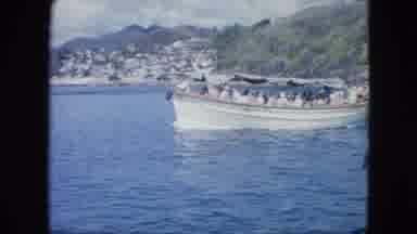 Martenique-1964: Views Of Houses On Rock Cuts To A View Of A Boat Full Of Passengers