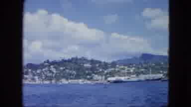 Martenique-1964: A View Of The Ocean Surrounded By Rocky Mountains
